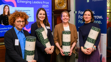 Four people receiving prizes